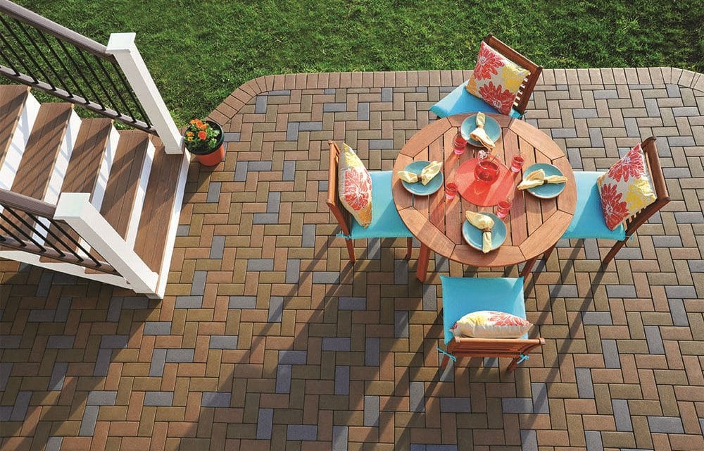 a table with 4 chairs outdoor and a patio paver