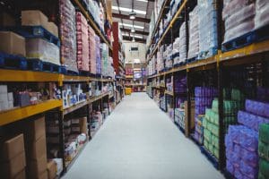 photo of a warehouse aisle -- toxic chemicals in building materials on elemental green