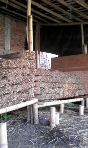 Photo of stacks of bamboo rods for use in GRASSBuilt bamboo engineered materials