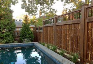 Cali bamboo dark bamboo fence by pool, 8 Amazing Eco-Friendly Fencing Options on elemental green