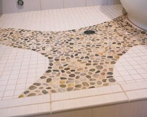 Photo of TDS Custom Construction Local River Rock Steam Shower Floor - bathroom remodel using locally sourced materials elemental green