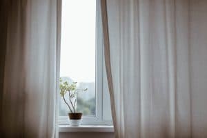 Breeze coming through curtains Pixabay - indoor air quality in your home elemental green