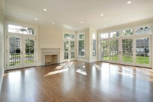 Photo of a bright living room with many windows from Deposit photos - mistakes to avoid when you're building or remodeling a green home