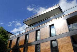 solar activated facade modern building exterior, 12 Companies Leading the Way With Eco-Friendly House Building Materials on elemental green