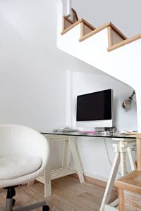 View of an empty modern home office space under wooden stairs, with a blank desktop computer screen, 17 trends for sustainable homes in 2017 on elemental green