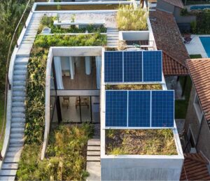 Exterior of Eco-house showing native garden, rooftop garden, solar panels - photo