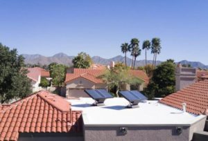 home with source water filtration hydropanels on rooftop, renewable energy