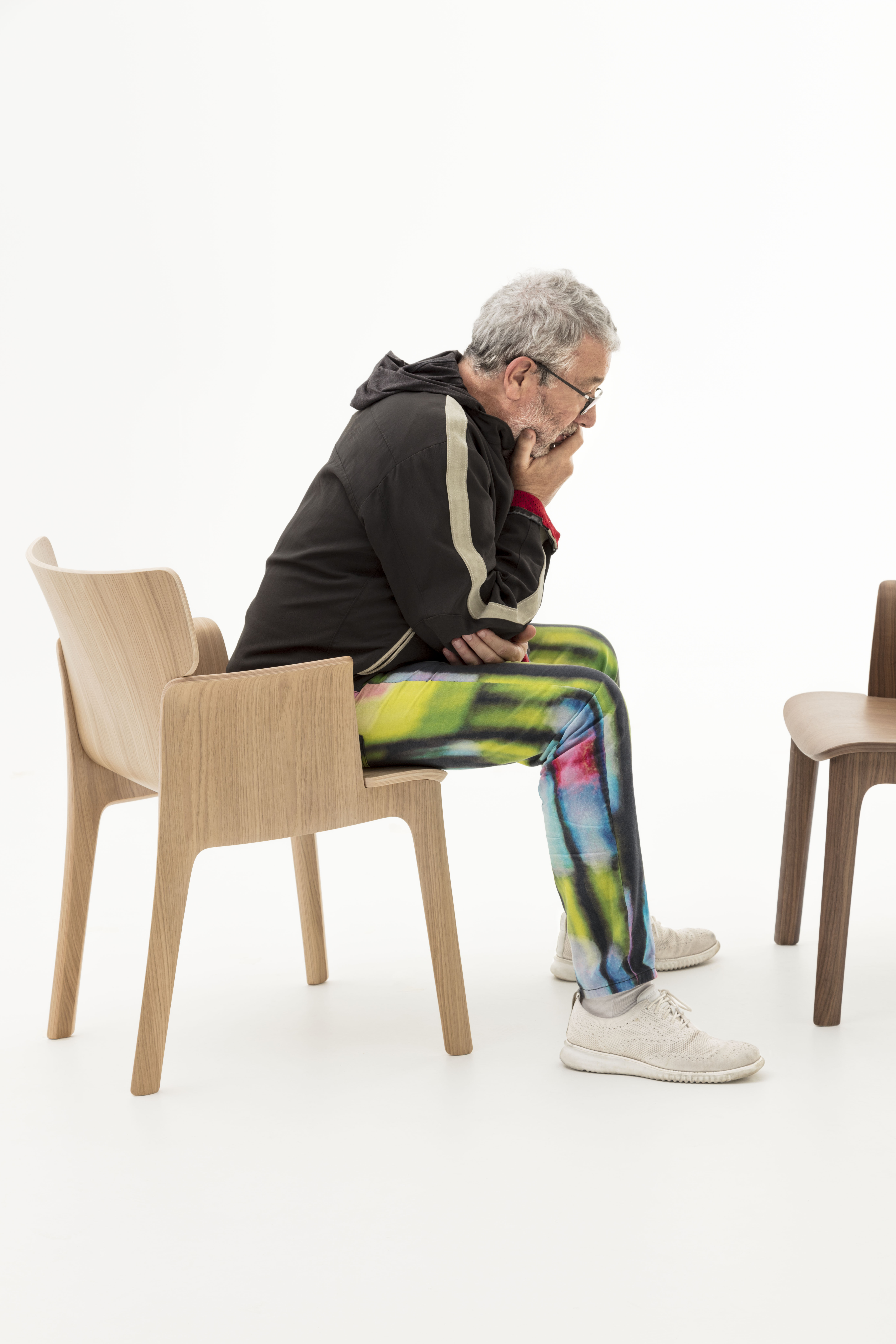 Philippe Starck sitting on the Adela Rex chair for Andreu World