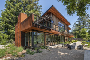 Clever Homes Custom Prefab Exterior, using siding milled from Redwood trees on property
