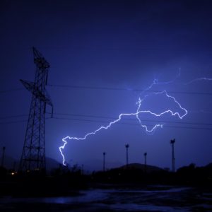 lighting strike electrical tower at night