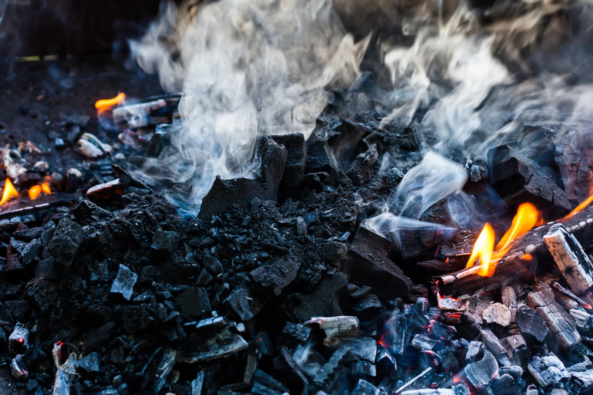Charcoal grill producing smoke