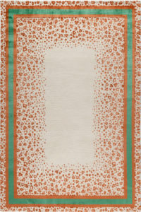 Patterned area rug with inner borger in green and organo-animal print in rusty orange