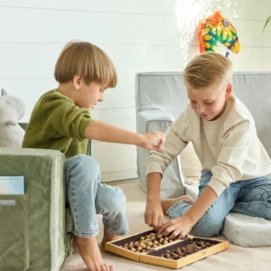 Two young boy unpakcing chess set - seated on low nontoxic play chairs from Brentwood Home - photo