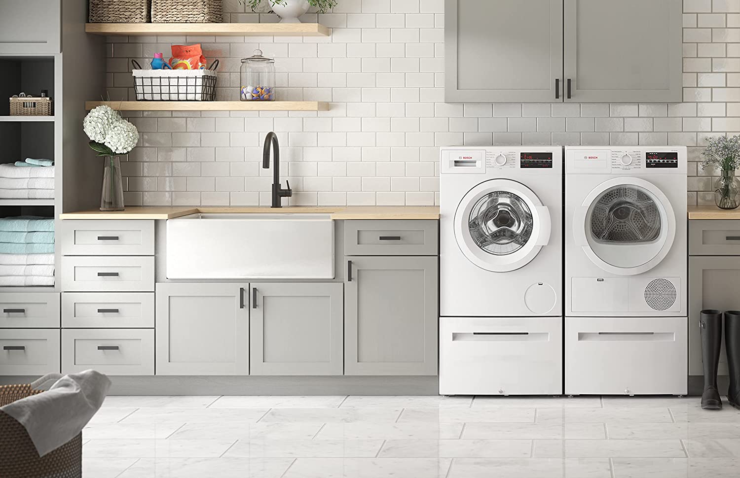 Bosch heat pump dryer in butler's pantry setting; white tile and gray cabinets