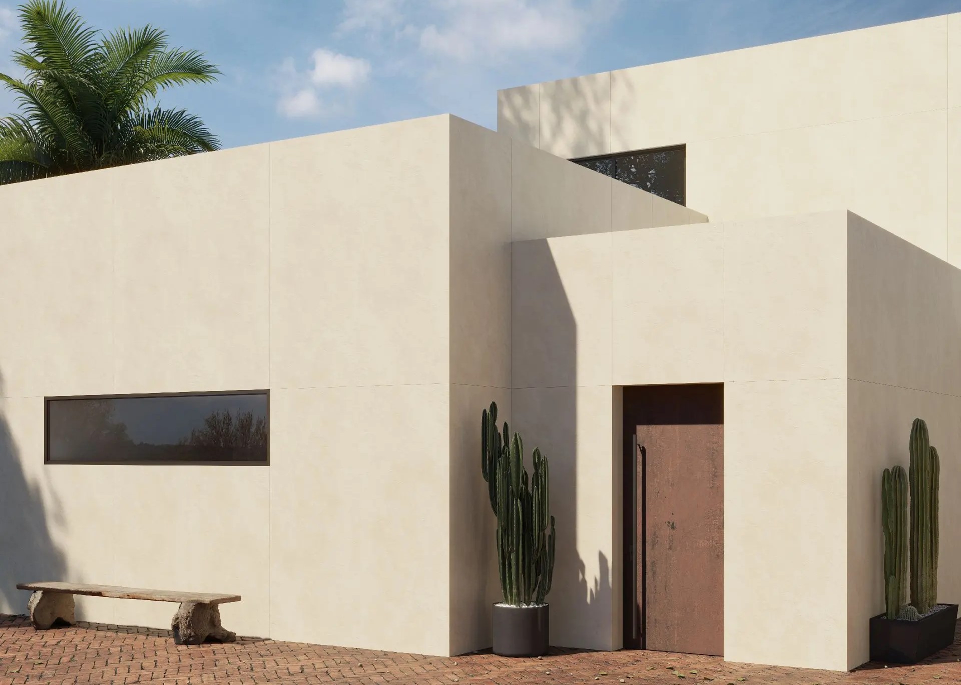 Exterior of Modern home with broad ivory-colored sintered-stone cladding from Dekton; small window apertures and cacti in pots