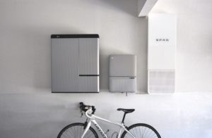White wall of garage showing Span energy monitoring system and LG battery backup