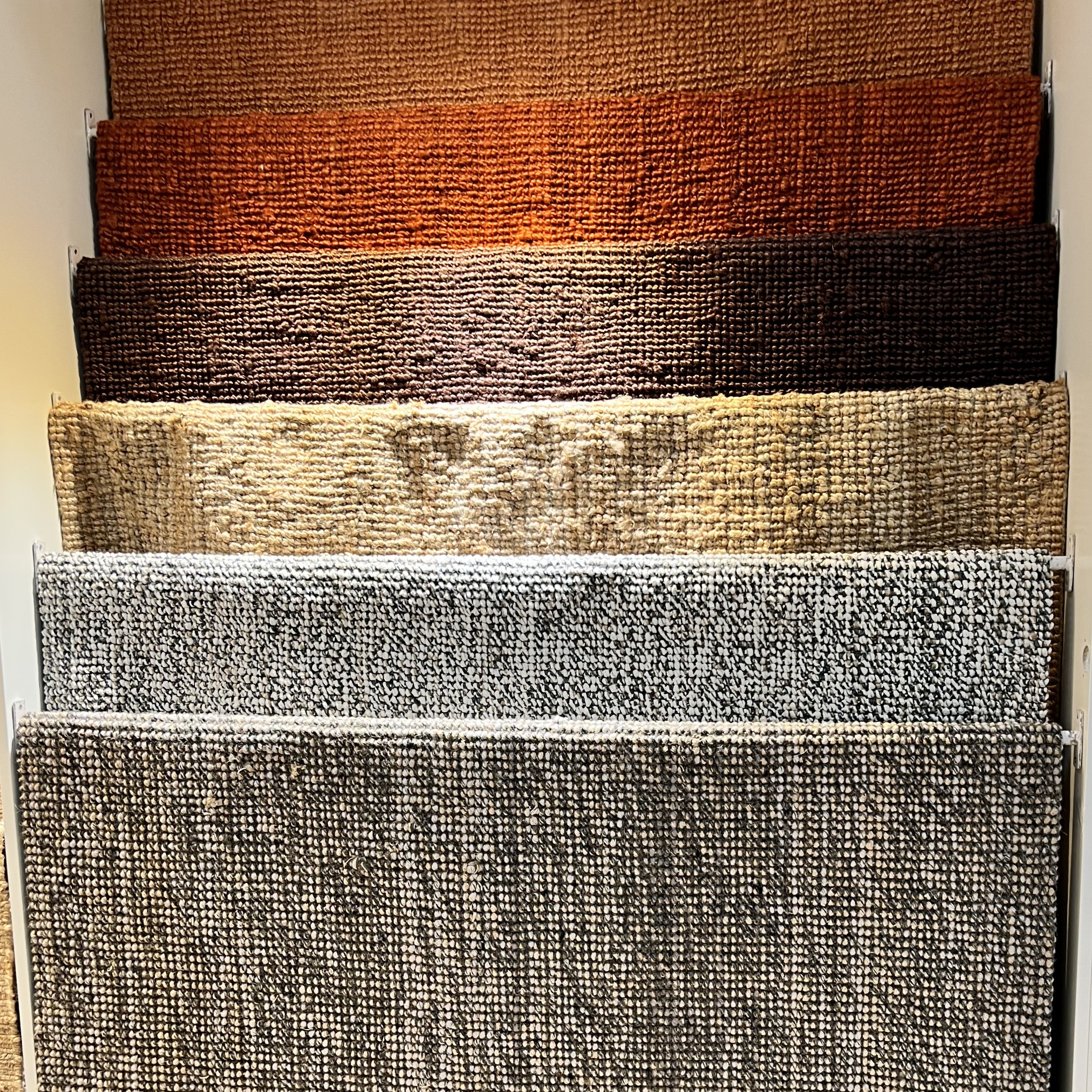 Hanging rug samples using sustainable textiles - photo