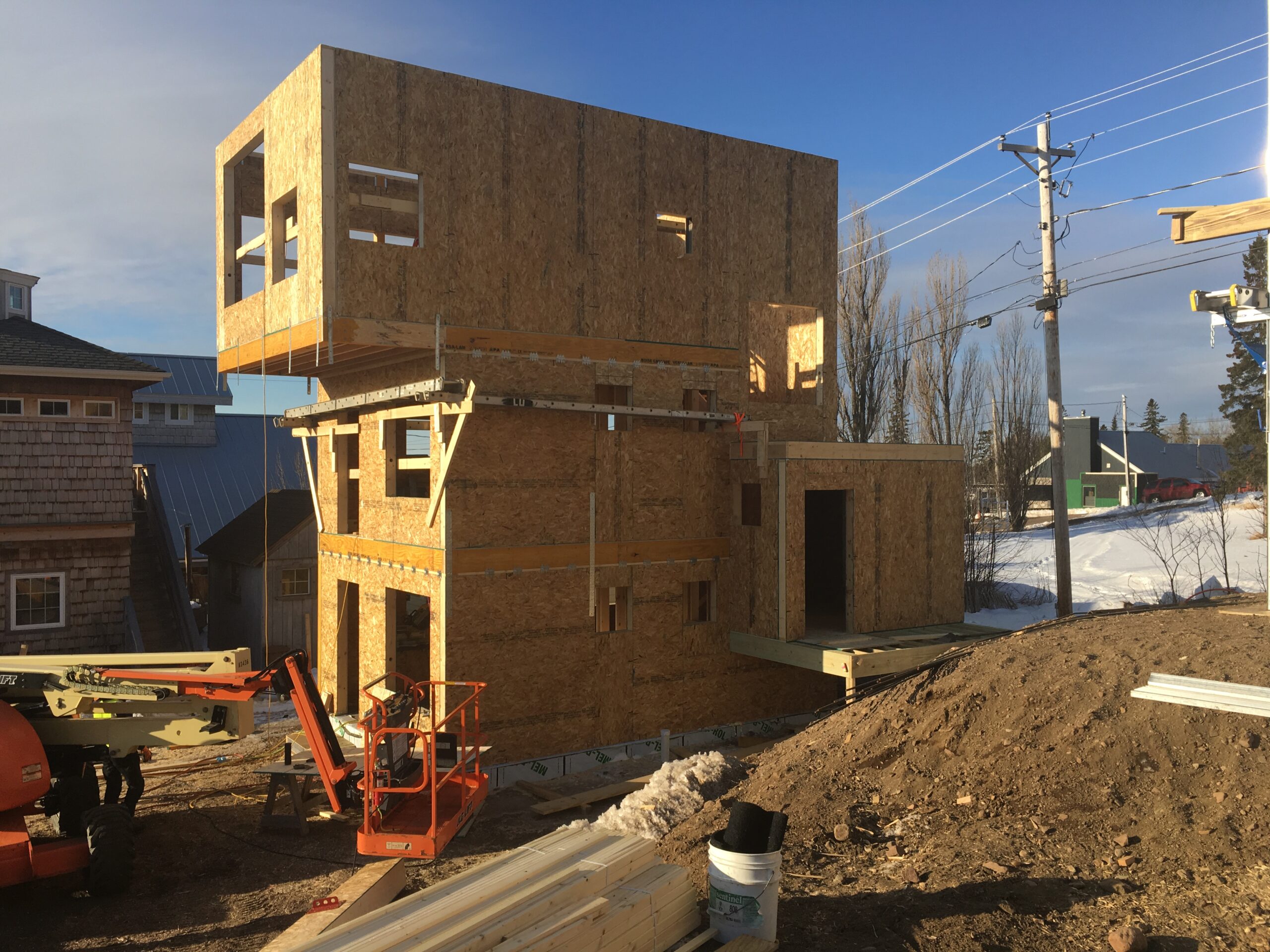 exterior view of modern home under construction using energy-efficient SIPs - photo 