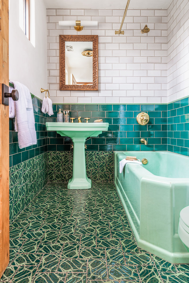 Bathroom with vintage fixtures and colorful tilework - photo
