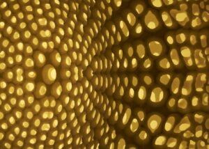Closeup of perforated glowing lampshade - photo